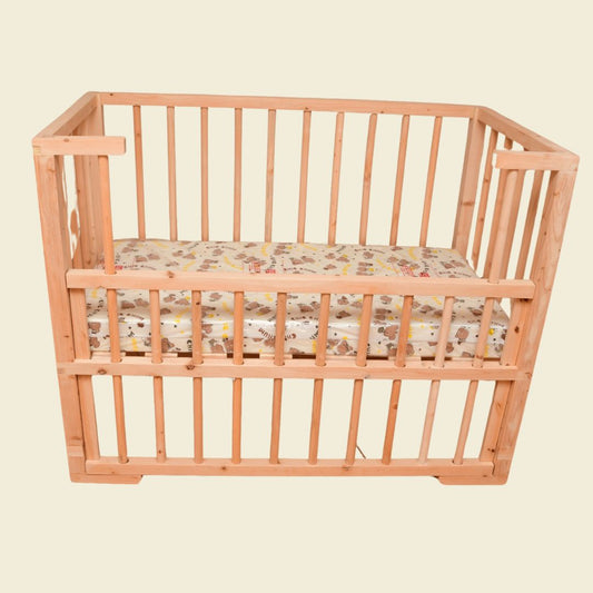 Wooden drop side baby cot in Kenya with smooth adjustable side panel for newborns