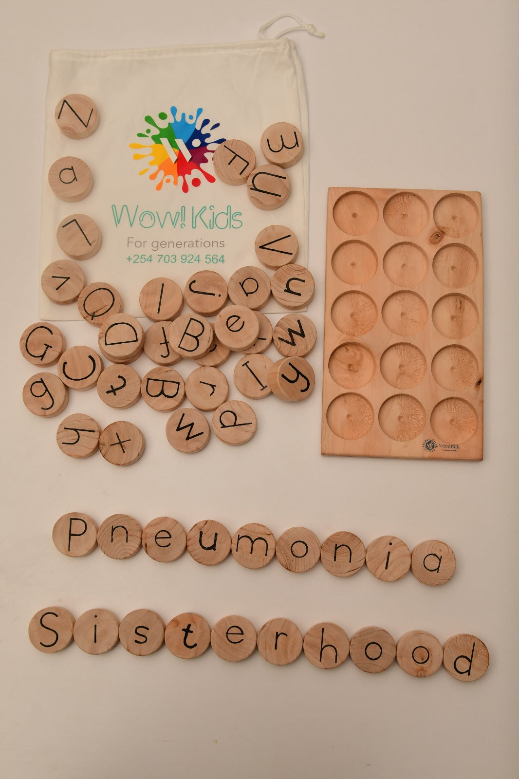 Children learning letters, forming words, and practicing spelling with wooden language set Wow Kids Toys Kenya