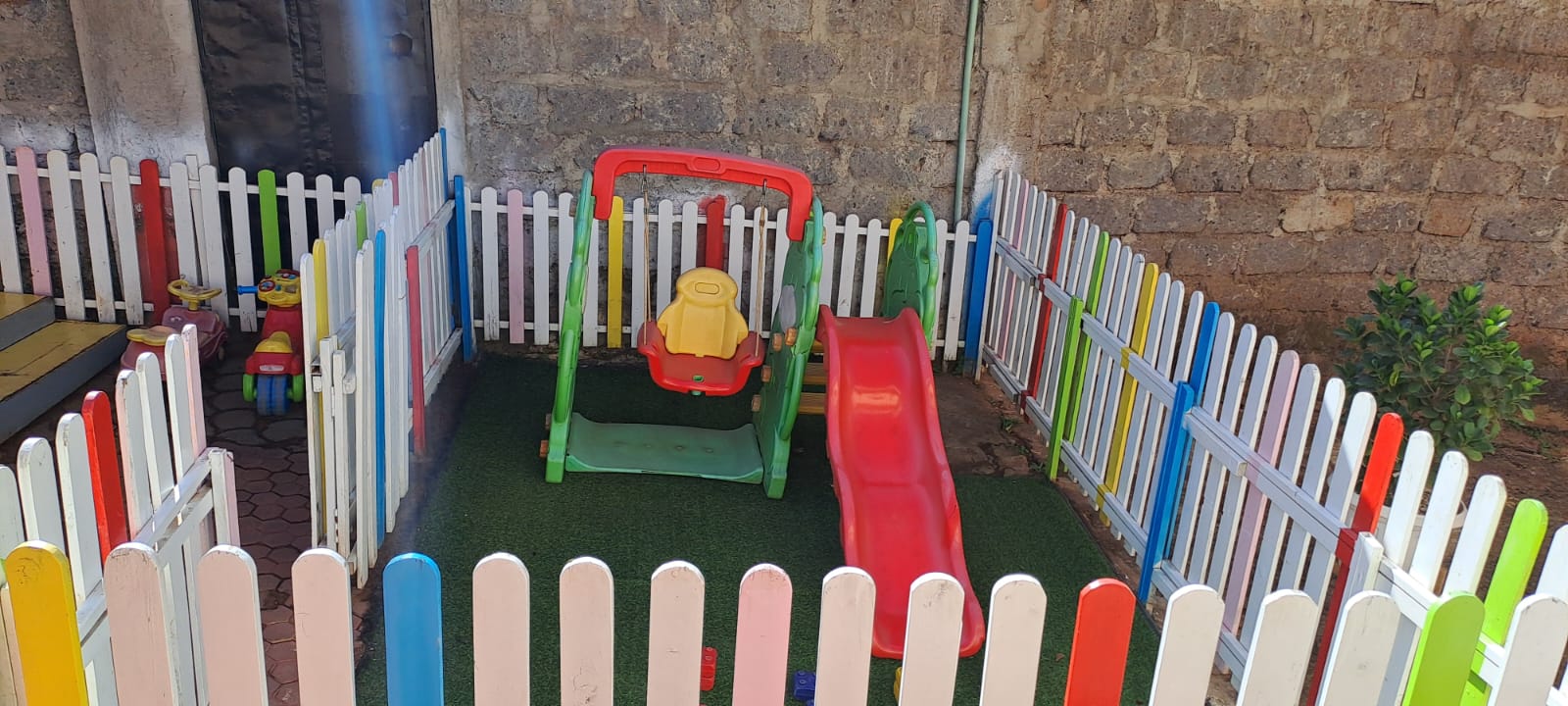 Colorful wooden fence toy for imaginative play and playground setup