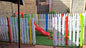 Colorful wooden picket fence for kids play area division at school or daycare