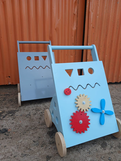 Colorful wooden toddler push walker with gears, spinner and shape sorter activity board