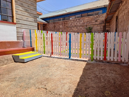 Custom-made wooden playground fencing in Kenya