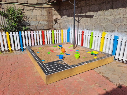 Customizable wooden sandbox for home, school, daycare, or balcony spaces