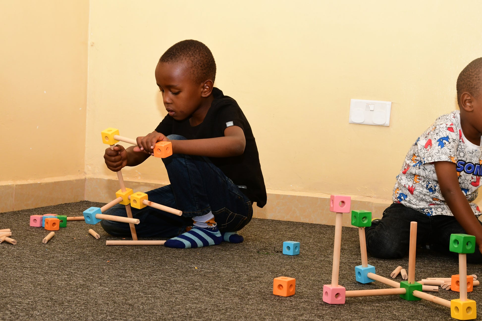 Durable wooden cubes and rods for creative construction