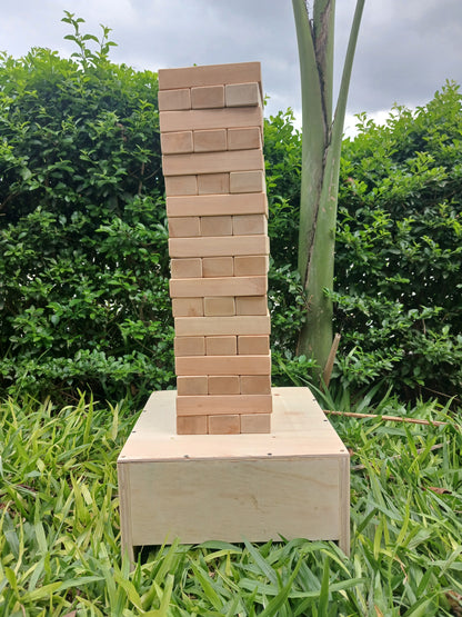 Family enjoying Wow Kids Giant Jenga during a backyard gathering