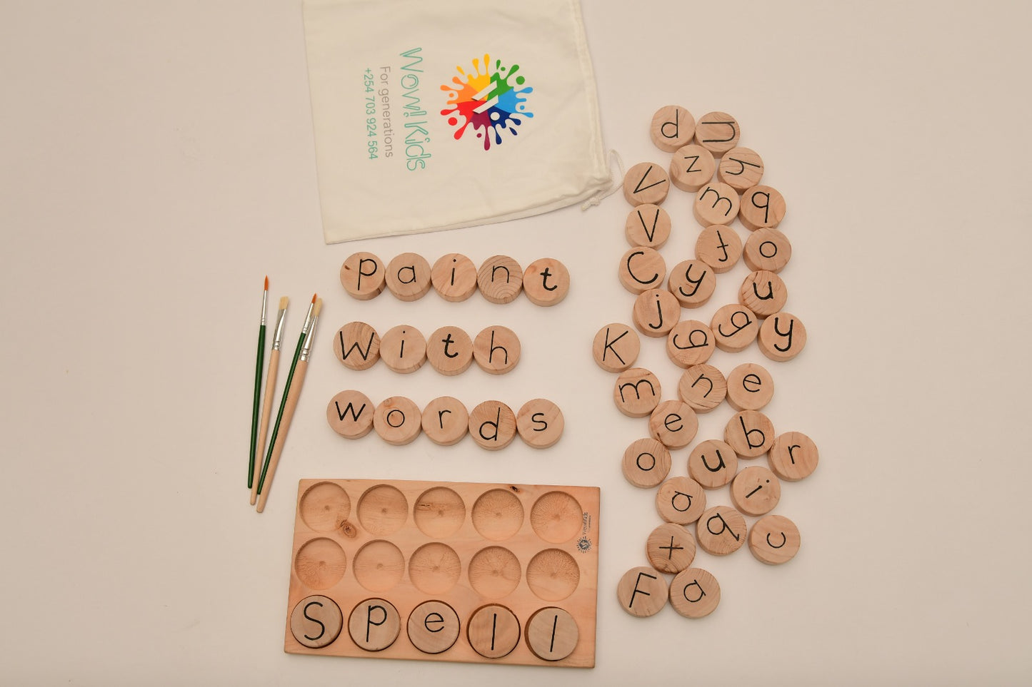 Interactive multilingual literacy toy with letter coins and crossword-style spelling board for preschool and home learning