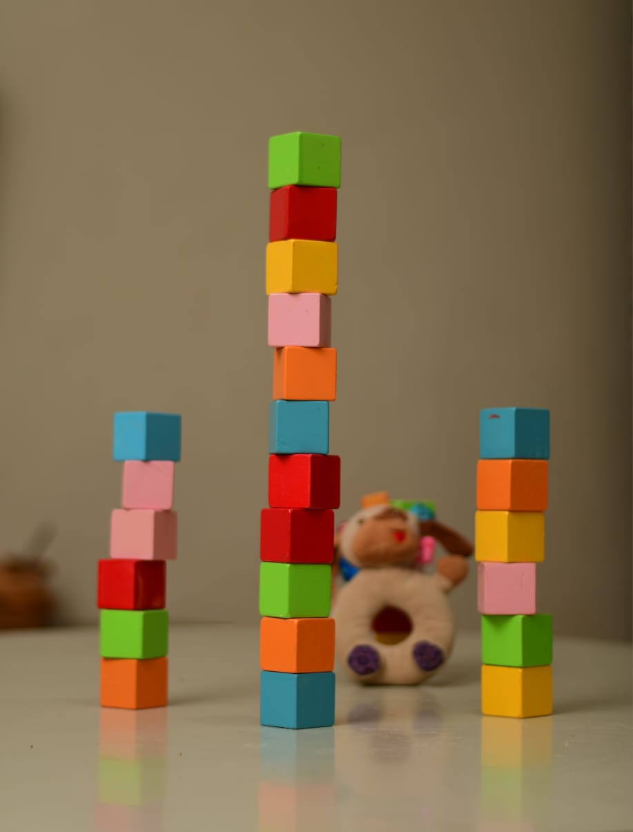 Kids building towers with wooden blocks educational toy set