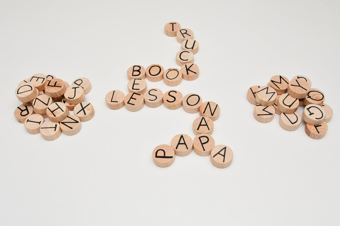 Multilingual wooden language set with 52 letter coins and spelling board for kids 3+ learning English, Spanish, Swahili, and French Kenya
