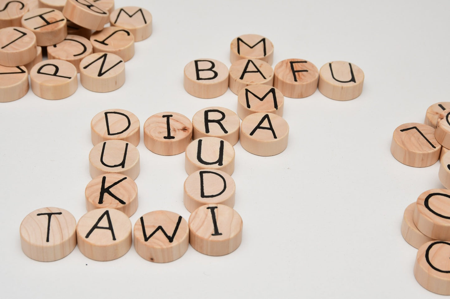 Multilingual wooden language set with 52 letter coins and spelling board for kids 3+ learning English, Spanish, Swahili, and French Kenya