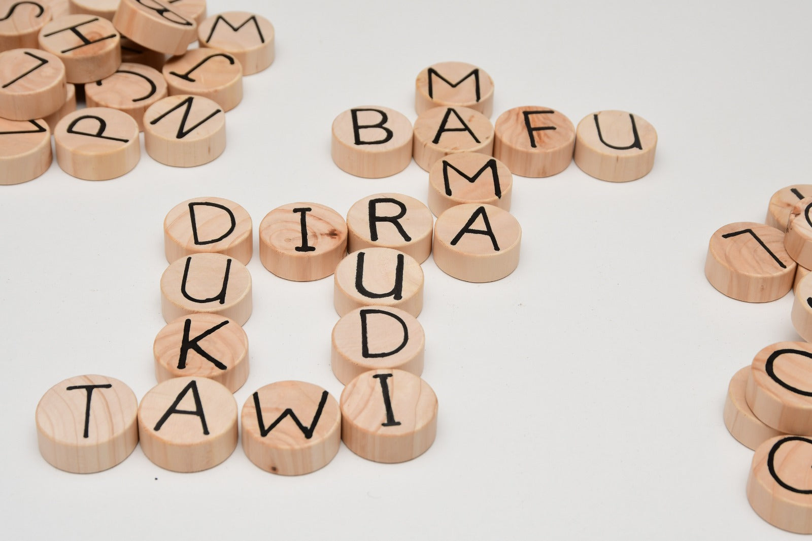 Multilingual wooden language set with 52 letter coins and spelling board for kids 3+ learning English, Spanish, Swahili, and French Kenya