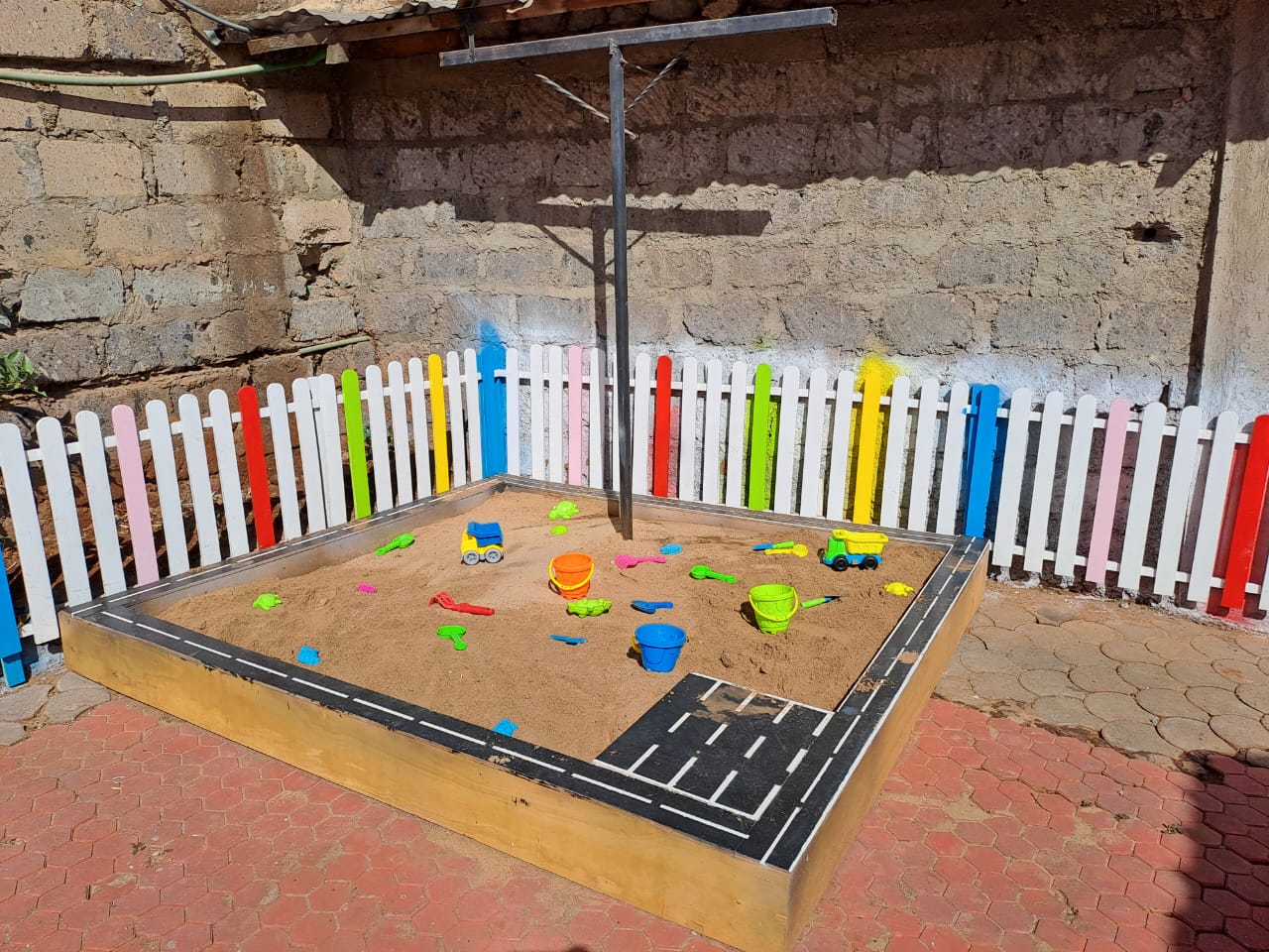 Spacious wooden sandbox with smooth edges, ideal for creative play and motor skills development