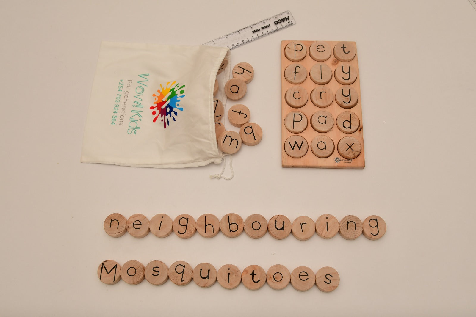 Interactive multilingual literacy toy with letter coins and crossword-style spelling board for preschool and home learning