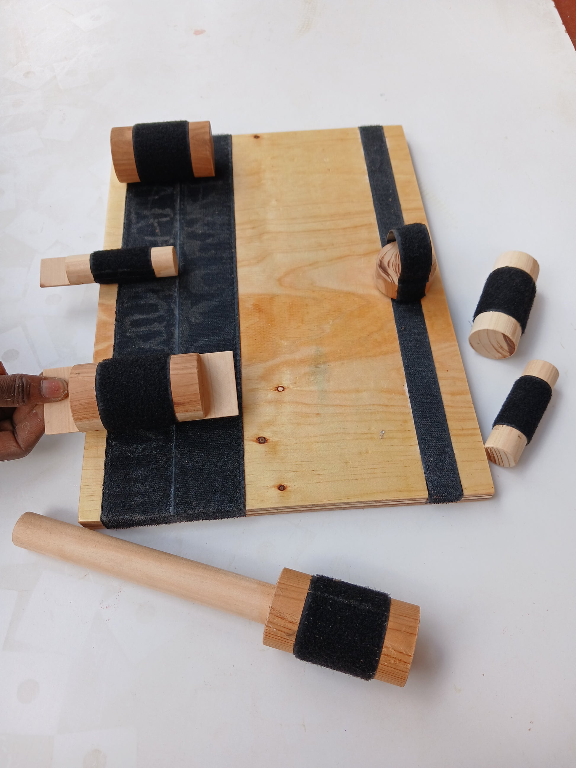 Wooden busy board for kids – occupational therapy toy in Kenya