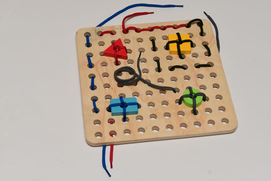 Wooden lacing board with threading shapes and colorful laces for fine motor skills development Kenya