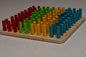 Wooden peg board with 100 colorful pegs for counting, sorting and pattern learning
