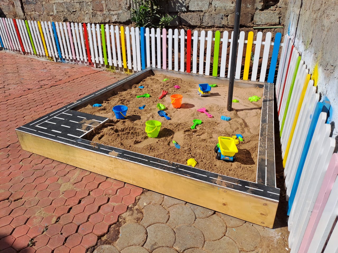 Wooden sand pit for kids with smooth edges, perfect for backyard, school, or daycare play