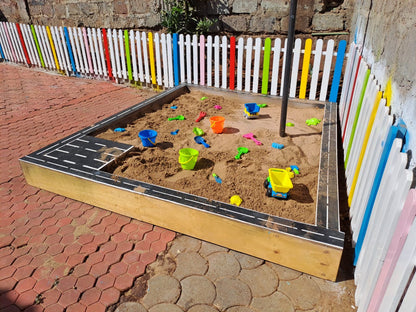 Wooden sand pit for kids with smooth edges, perfect for backyard, school, or daycare play
