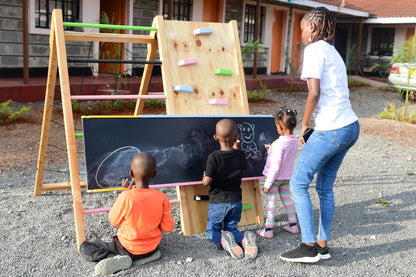 Wooden jungle gym slide that doubles as a chalkboard for creative play