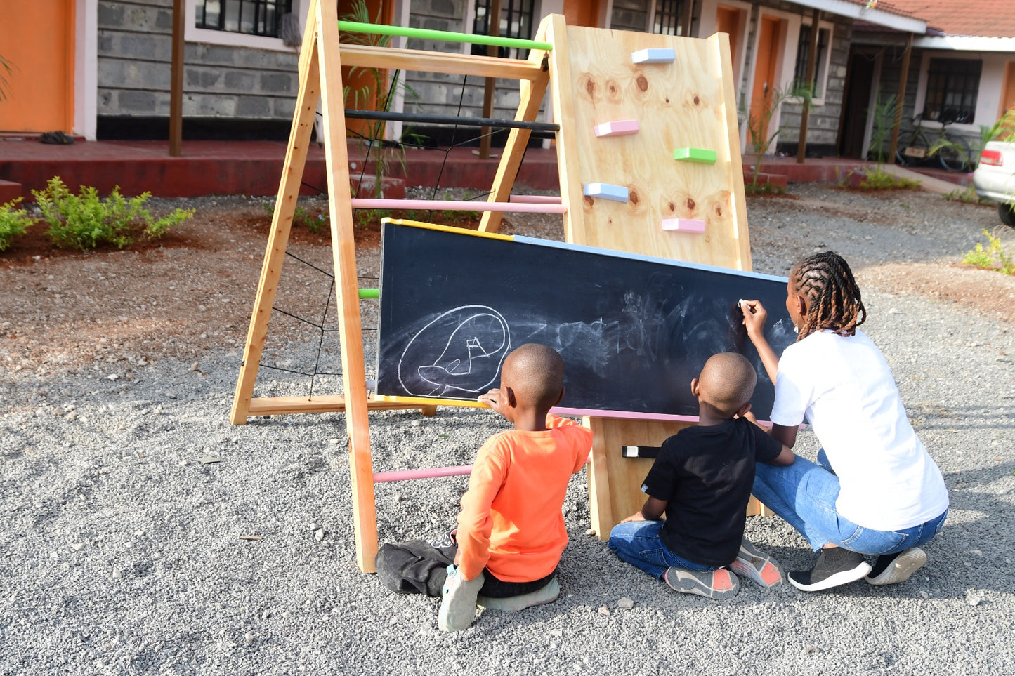 wooden slide with chalkboard jungle gym