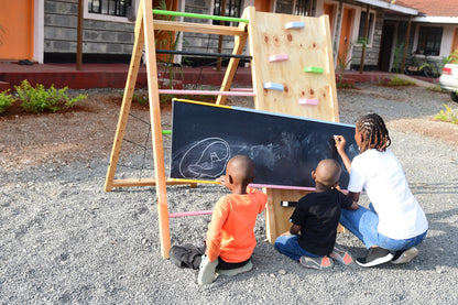 wooden slide with chalkboard jungle gym